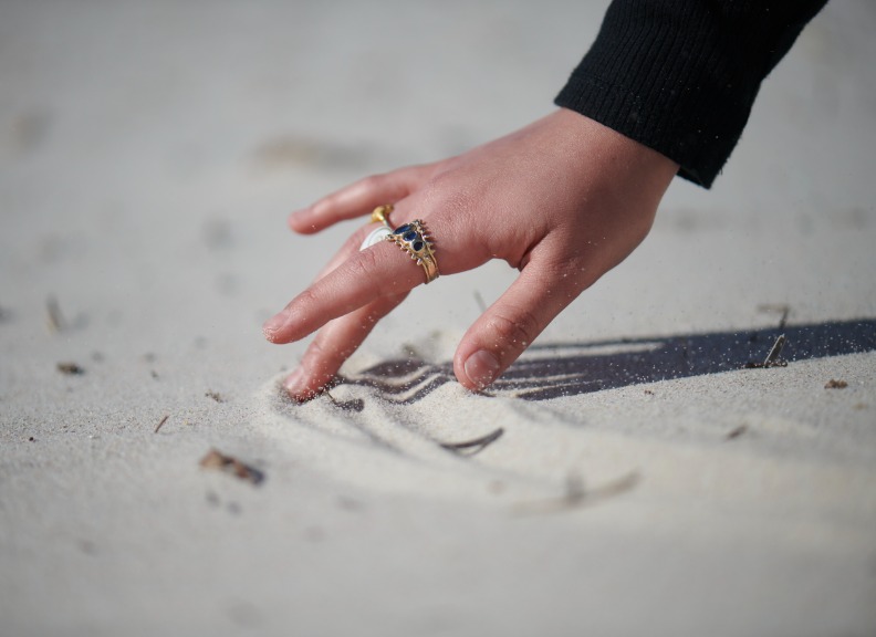 Hand drawing in sand