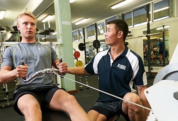 student on rowing machine
