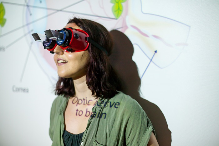 Woman wearing vision measuring device