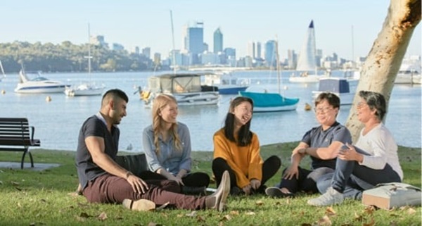 a group of students chatting on the Matilda Bay foreshore