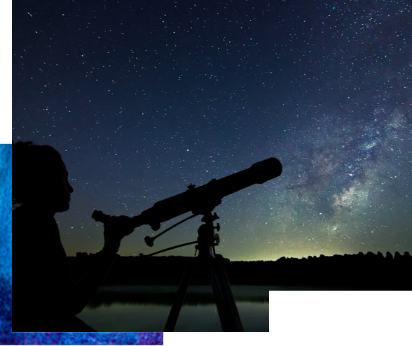 Silhouette of a person using a telescope at night