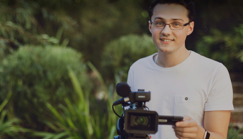 Communications student with video camera