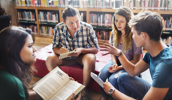 Student discussion happening in a library