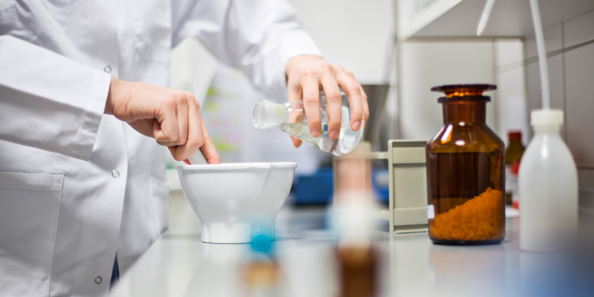 Pharmacist formulating and researching drug delivery