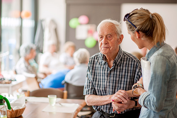 Elderly person with a carer