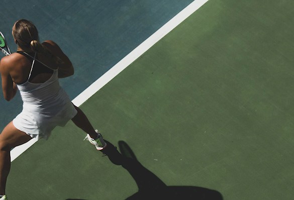 Elite tennis player on court preparing to return a serve