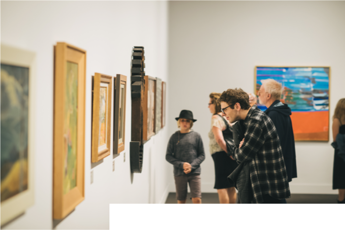 people viewing art work in a gallery