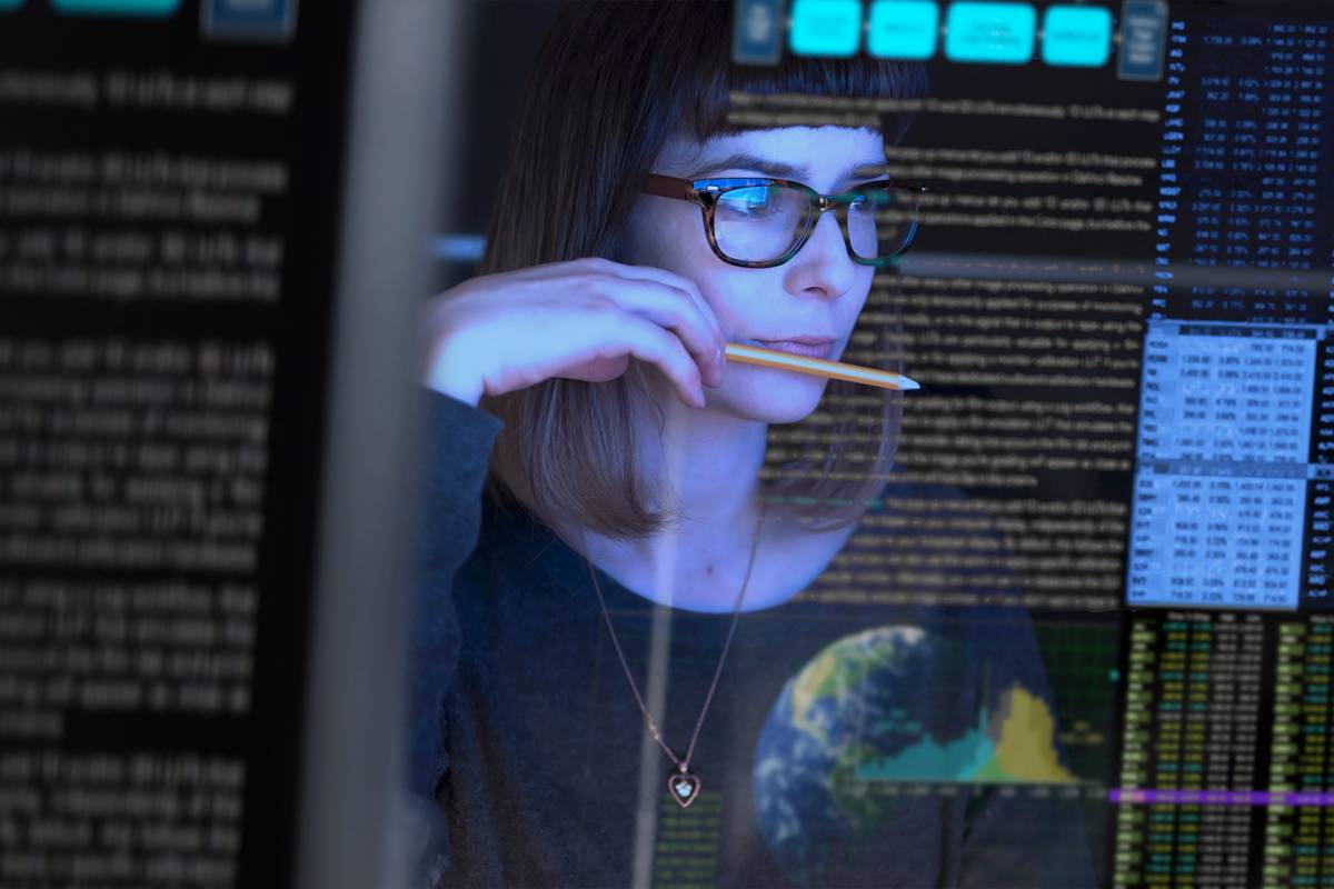Image of woman looking at data on a screen