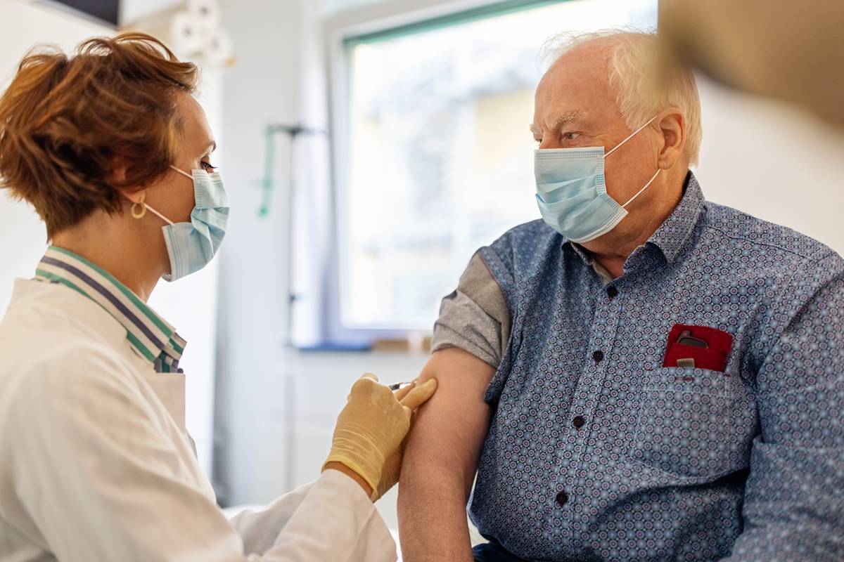 Image of a doctor giving a patient a needle