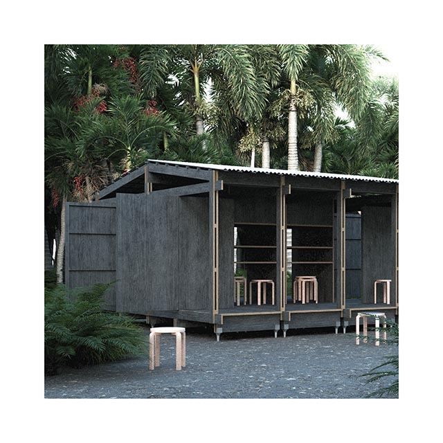 An image of a small grey house amongst trees. 