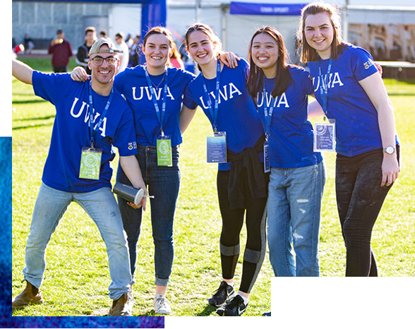 Group of smiling students wearing UWA shirts