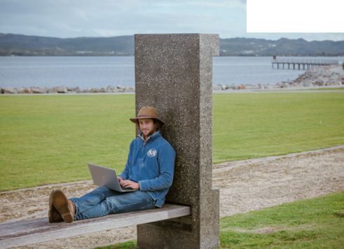 student studying on bench