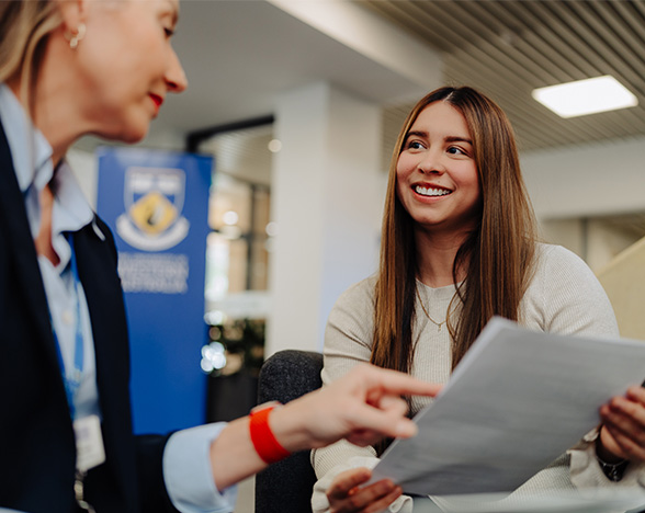 A prospective student meets with a UWA staff member at UWA CELT Student Services