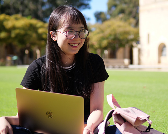 Student outside at the UWA Crawley campus