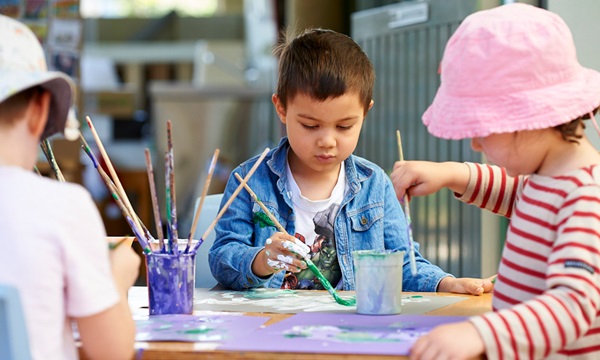 Children painting outside