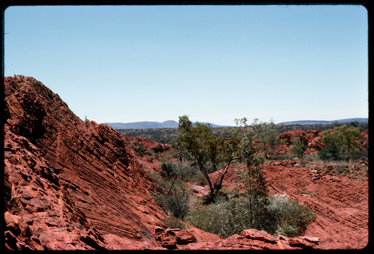  landscape imaging depicting red rock formation with blue sky