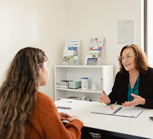 Student and teacher sitting together