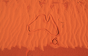 Outline of Australia drawn in red dirt