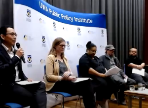 Moderator and panellists on stage for arts policy event by the UWA Public Policy Institute