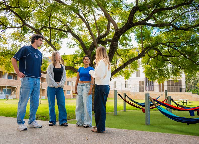 Image of students gathering together at St Thomas Moore College