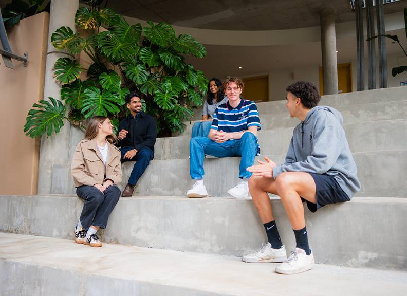 Image of students sitting outside at St Catherine's College