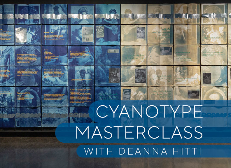A large display of cyanotype prints exhibited in an art gallery