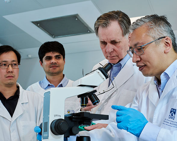 Professor Barry Marshall, Dr Alfred Tay and their team working on Helicobacter Pylory 
