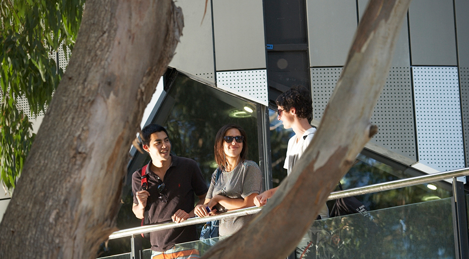 Students on balcony at Business School