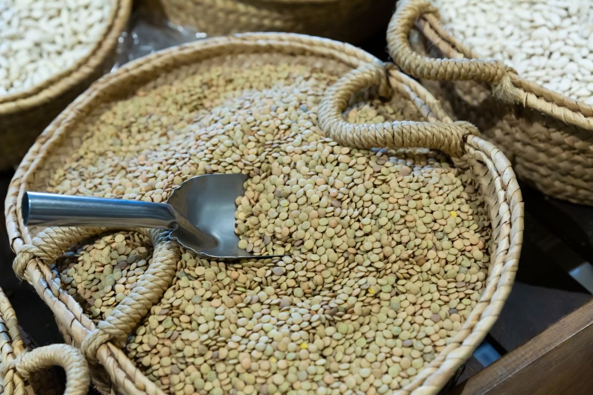 A basket of dried lentils in a market Credit - Getty Images