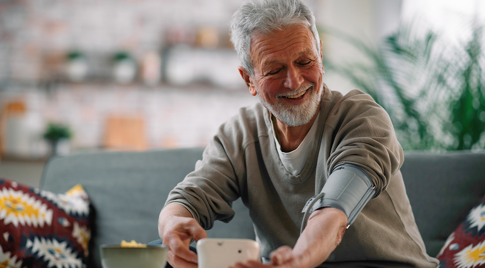 Elderly man having blood pressure taken