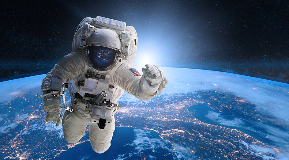 An astronaut floating about in space