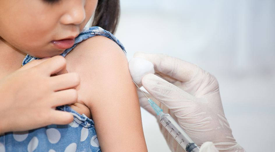 Young girl being vaccinated