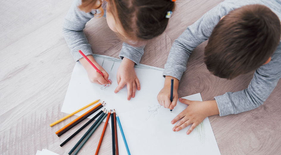 Kids drawing with pencils