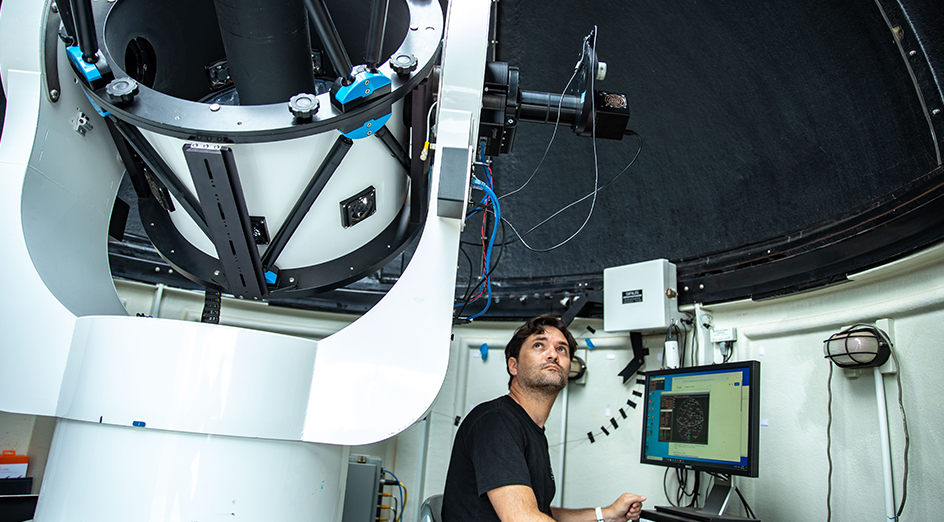 Researcher working with data transfer machine