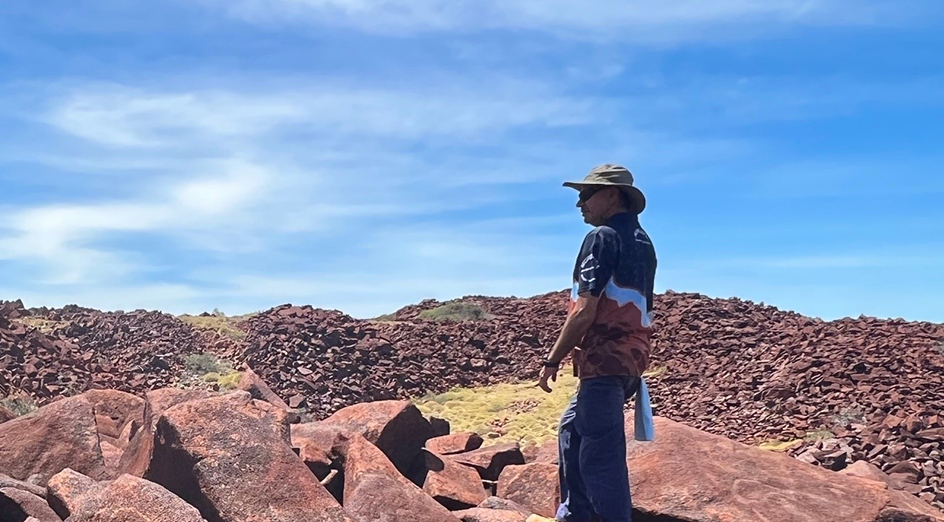 Senior Ranger Peter Cooper visiting a significant rock art complex in the archipelago. Credit: Jo McDonald.