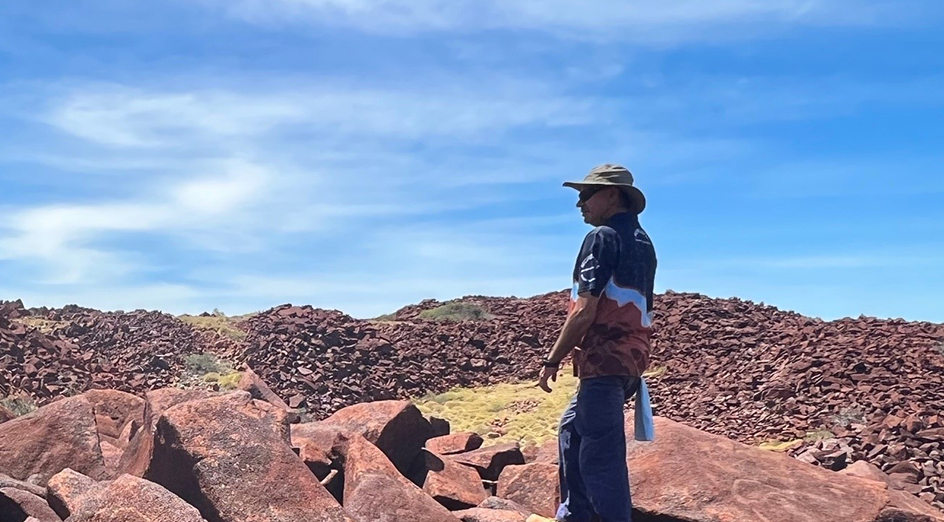 Senior Ranger Peter Cooper visiting a significant rock art complex in the archipelago. Credit: Jo McDonald.