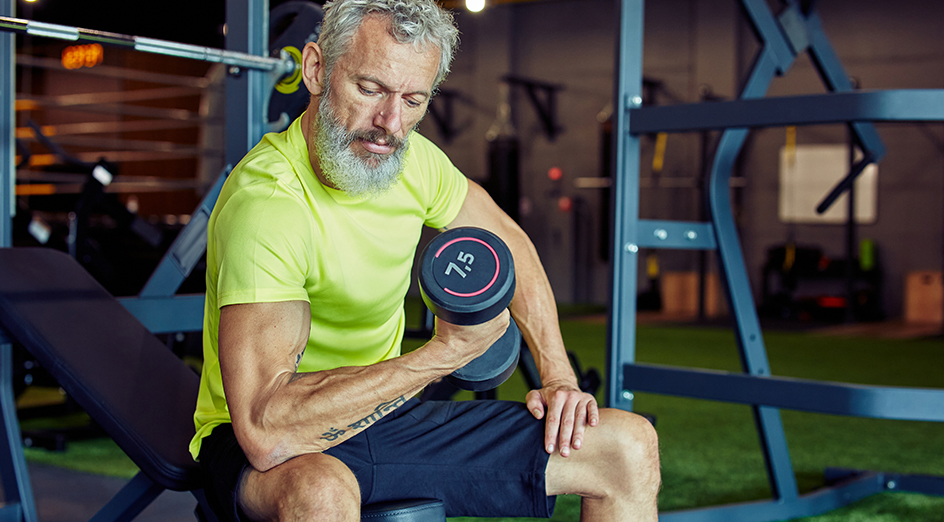 Older man lifting weights