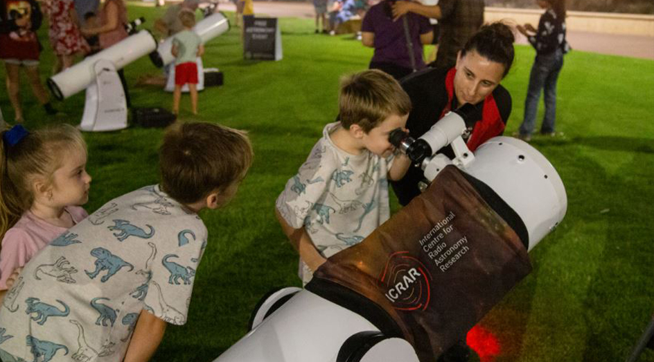 Kids looking through telescope