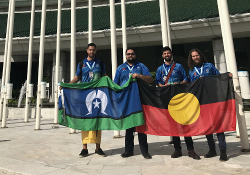 Group holding up Aboriginal and Torres Straight Islander flags