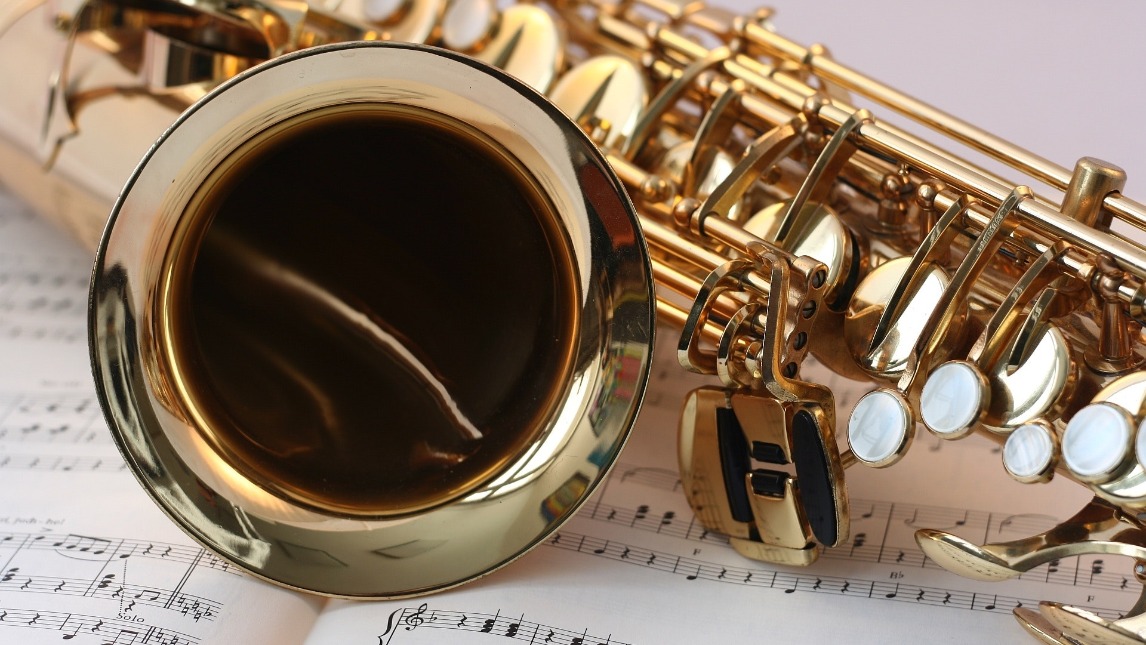 Close up of saxophone and sheet music
