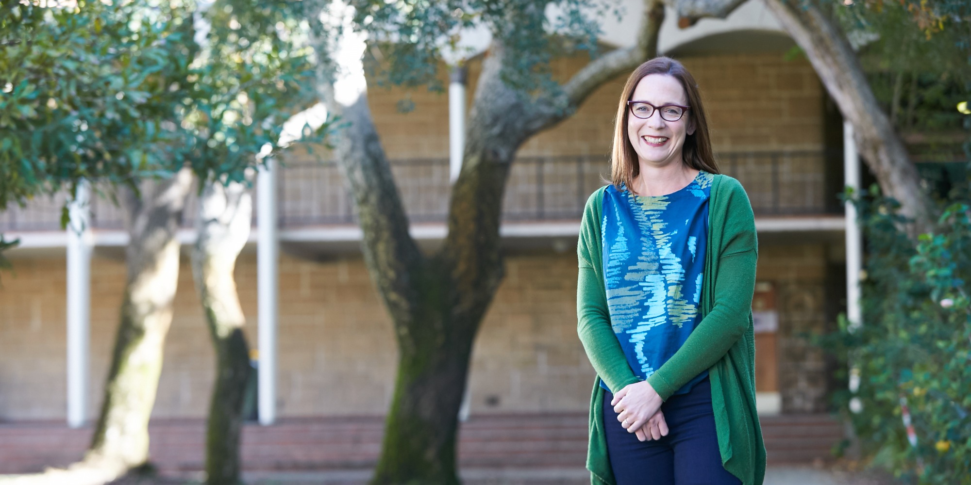 Tanya Dalziell  in front of Arts building