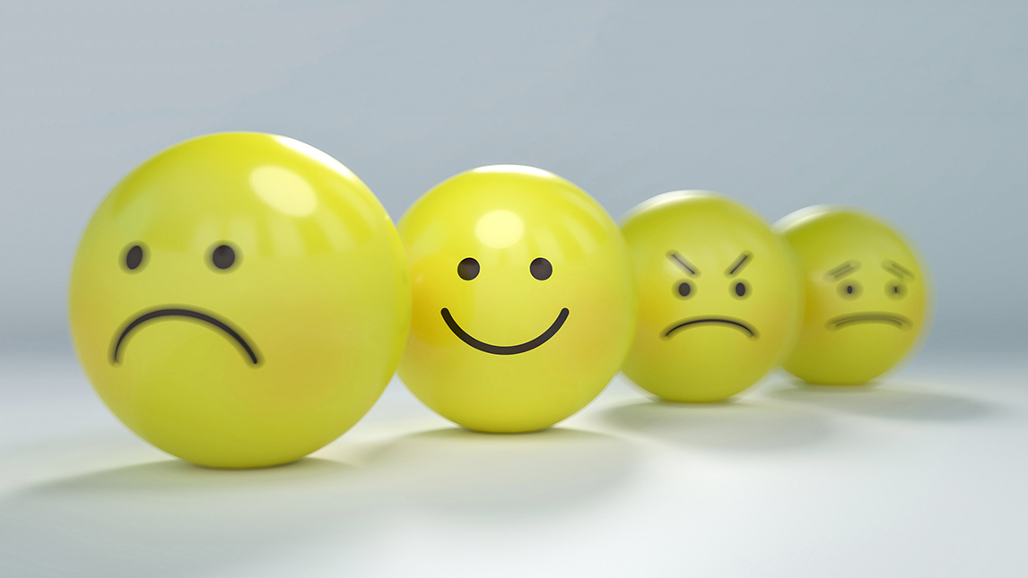 yellow balls with various emotions