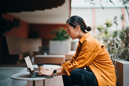 female student using a laptop