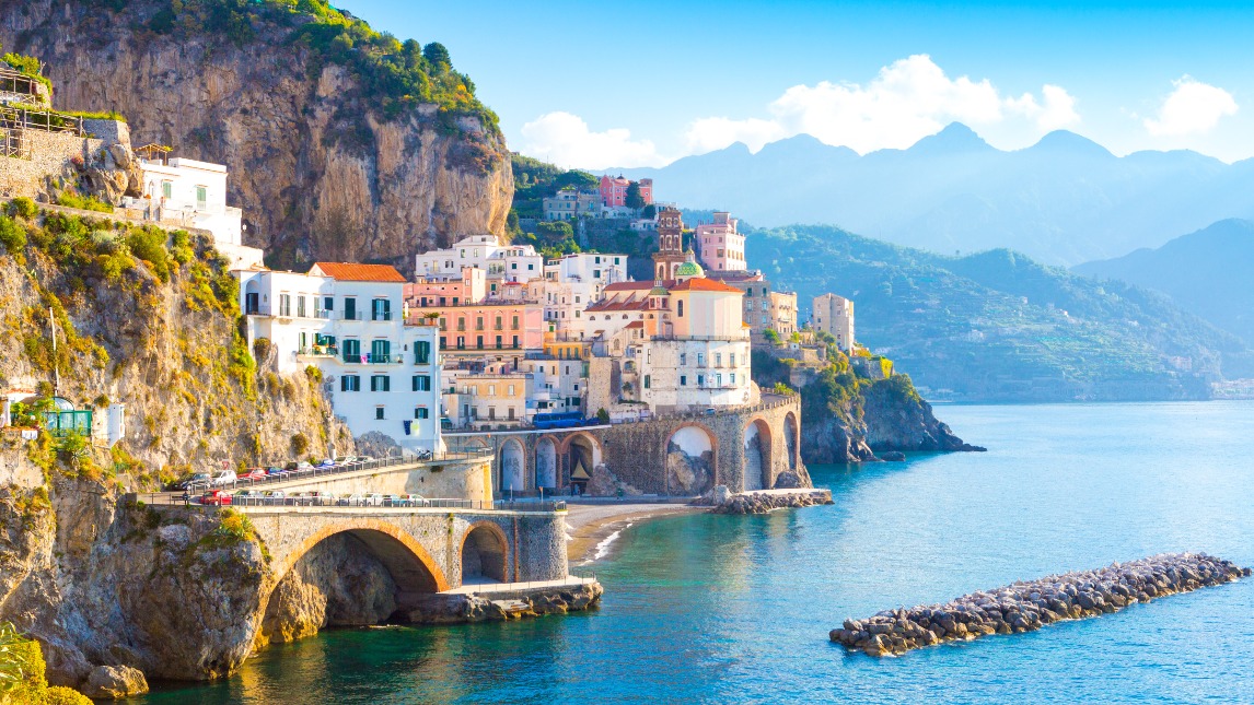 Morning view of Amalfi cityscape on coast line of mediterranean sea, Italy