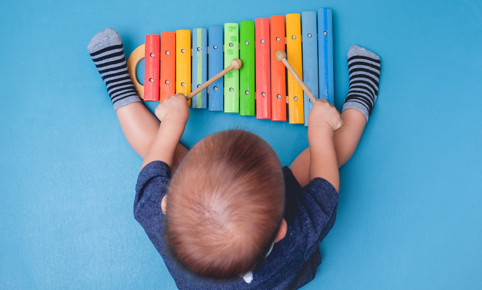 Toddler playing musical instruments