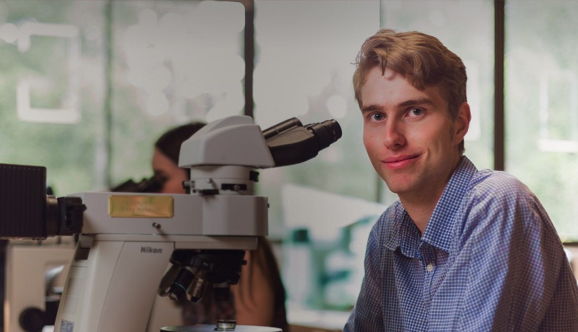 Science student working with microscope