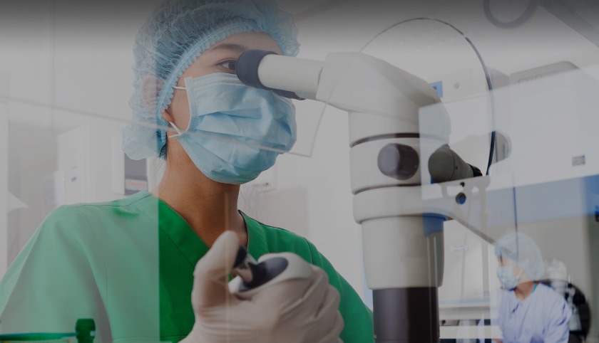 Lab technician and microscope