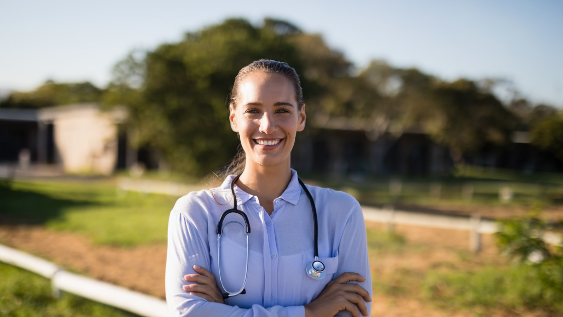Smiling female medical student in rural location