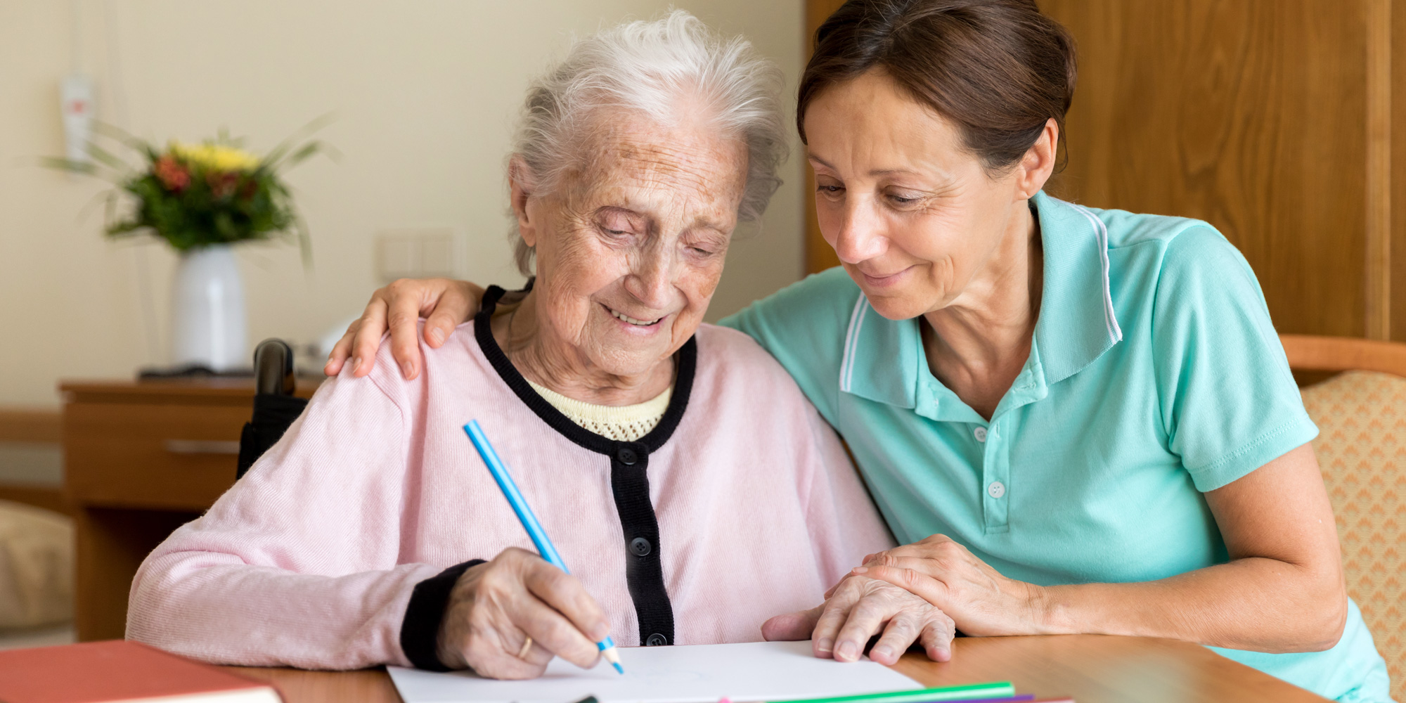 Elderly person with a carer