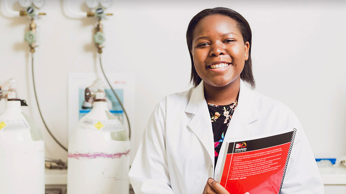 Woman in doctors coat  in lab
